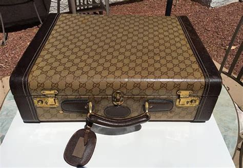 gucci luggage made in italy.